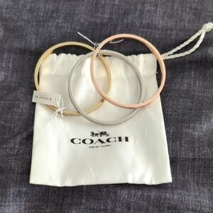 Coach Trio Bangles in Gold, Silver, and Rose Gold